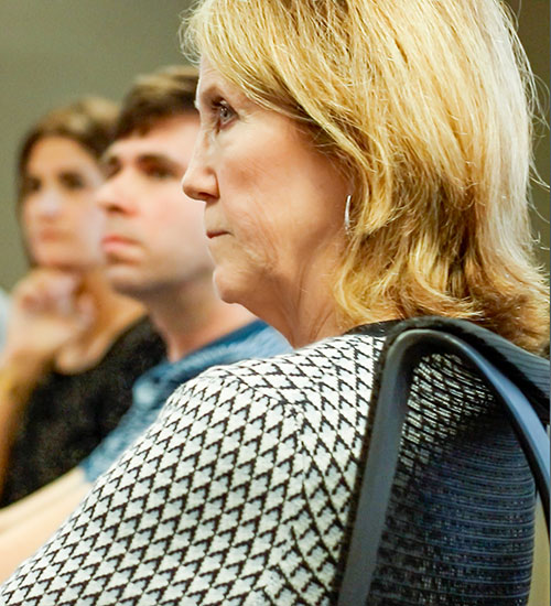 Woman sitting at conference table